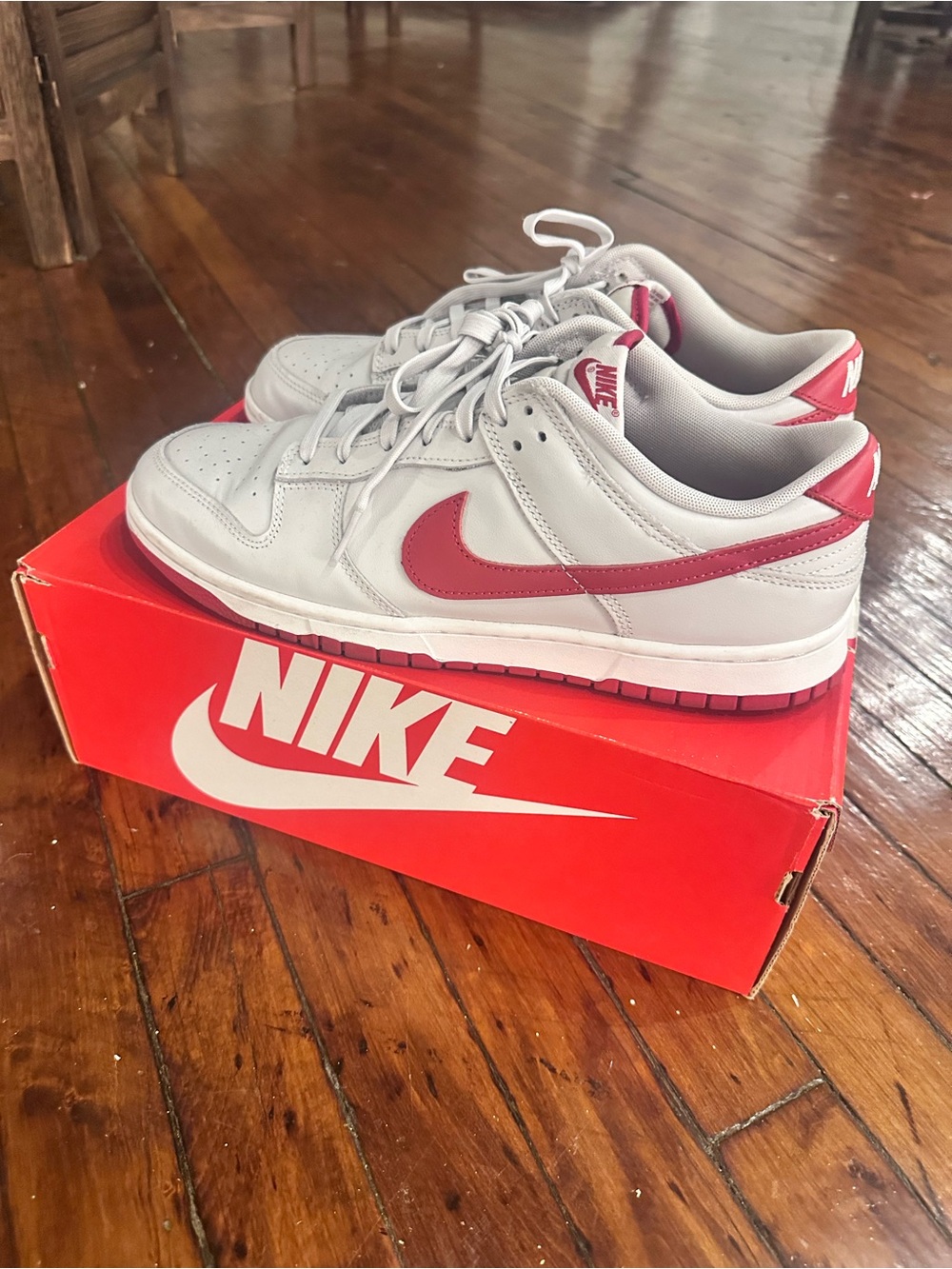 Nike Dunk Low Sneakers in White and Red Swoosh